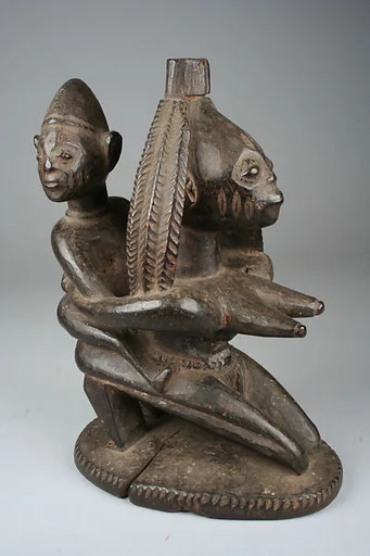 Vessel Support: Kneeling Mother with Child Figure