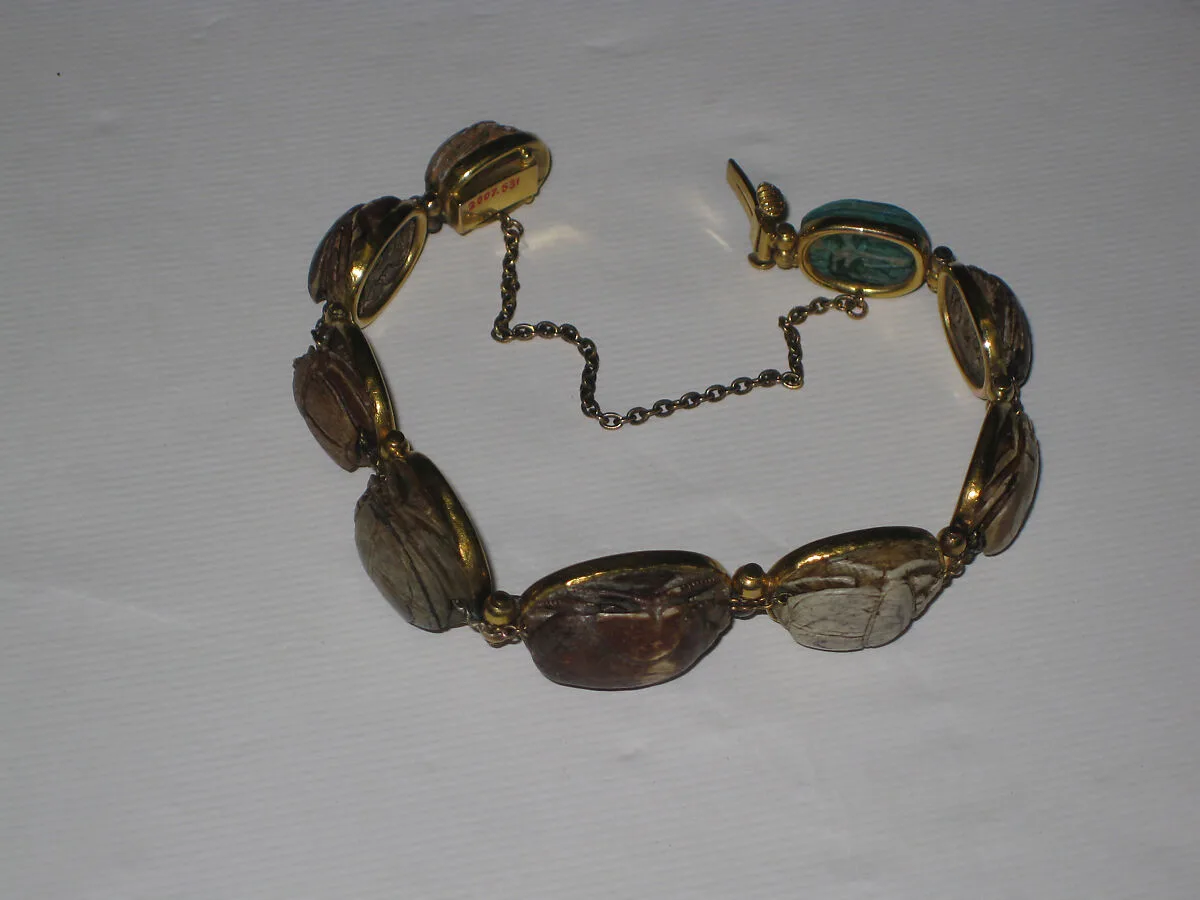Nine scarabs set in modern bracelet. — Unknown