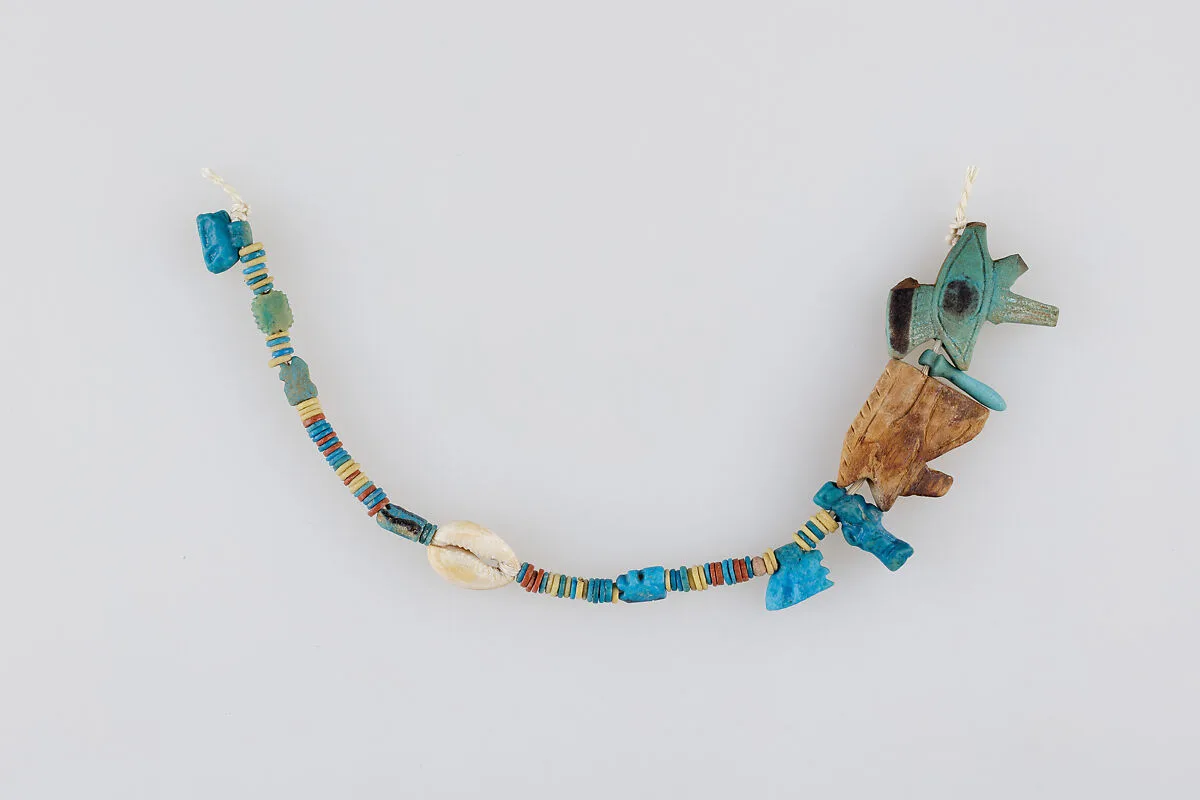 String of Beads and Amulets — Unknown
