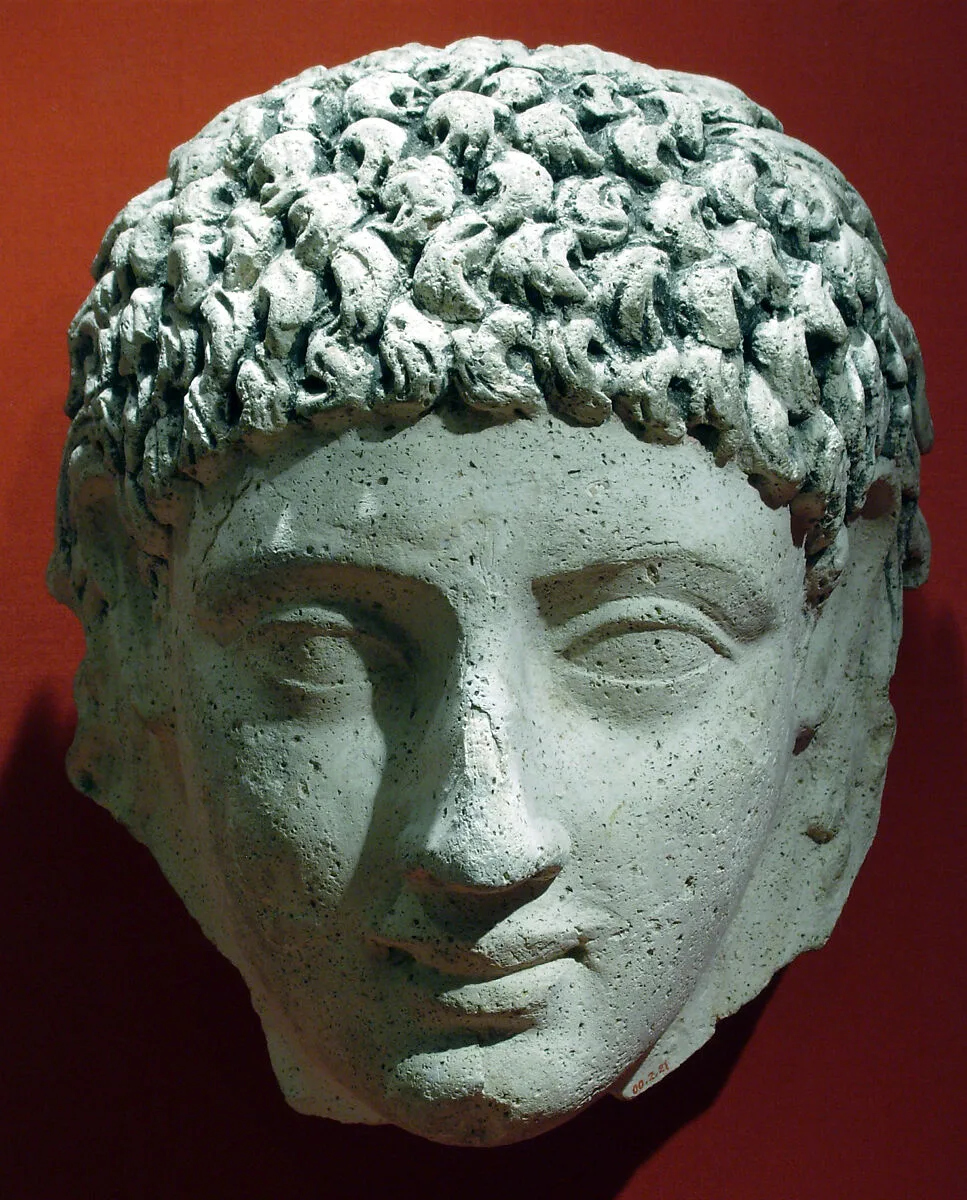 Mask of a young person with an unusual hairstyle — Unknown