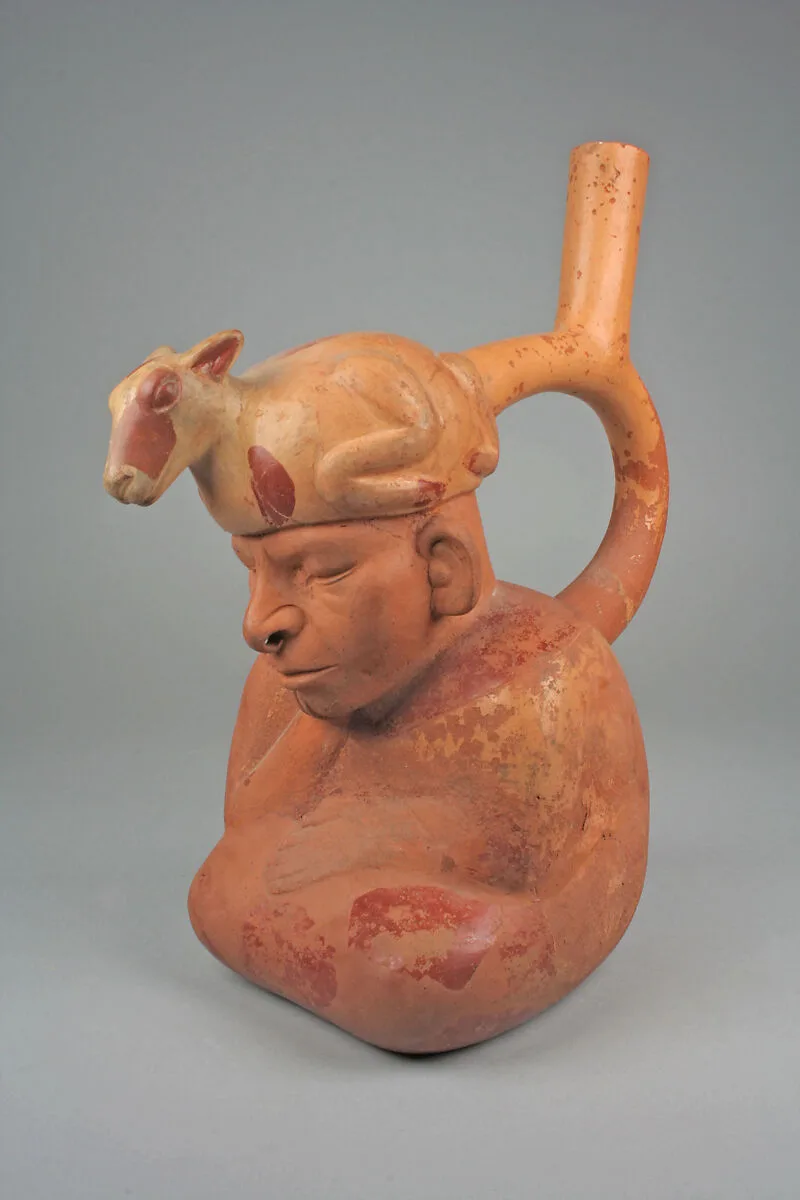 Stirrup spout bottle with figure with llama headdress — Unknown