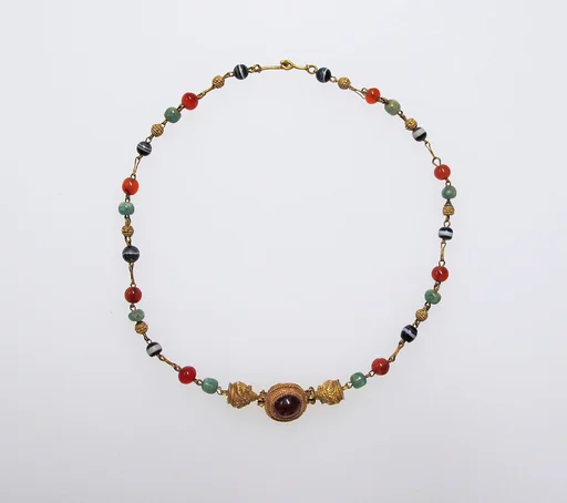 Gold, emerald, carnelian, banded onyx, and garnet necklace