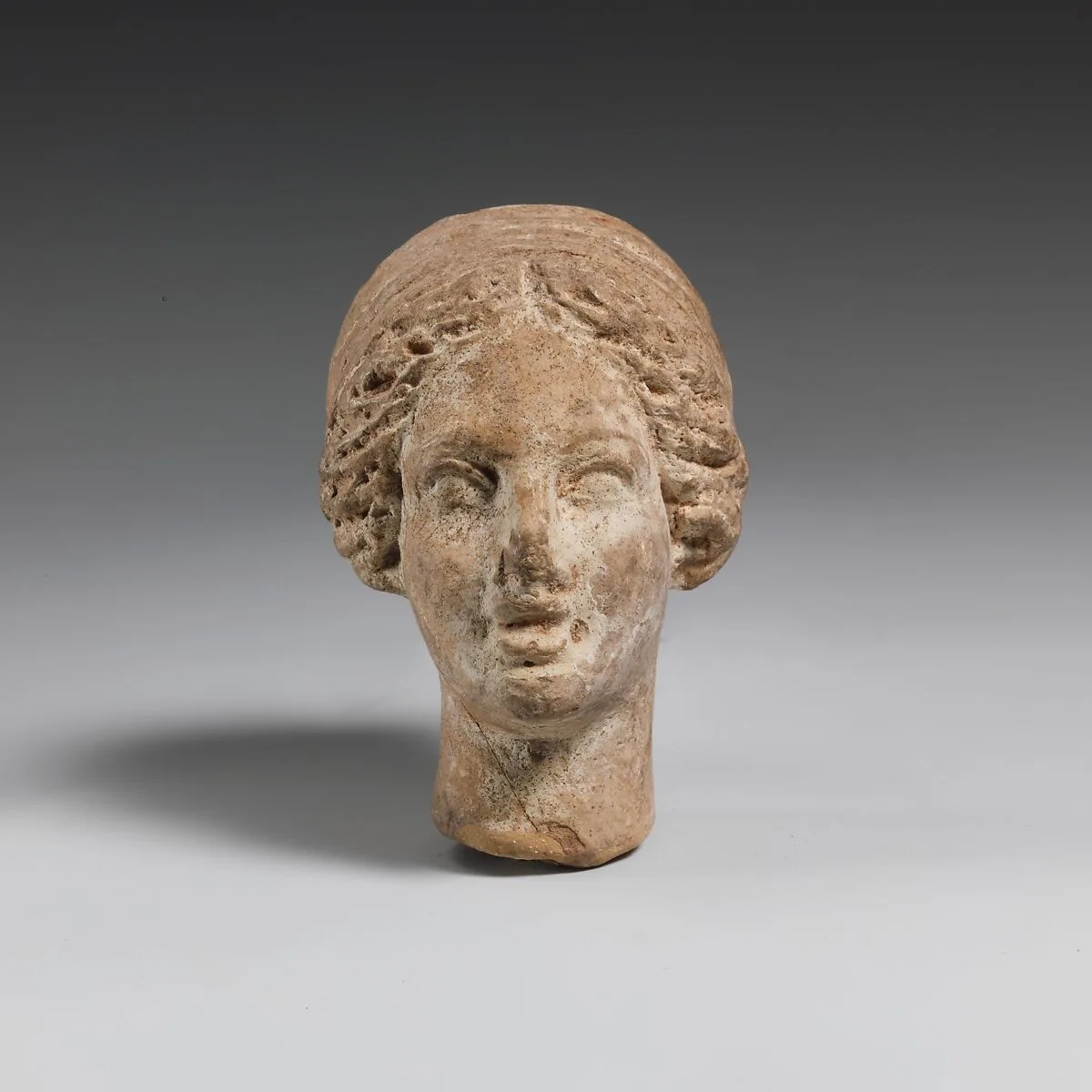 Terracotta head of a woman — Unknown