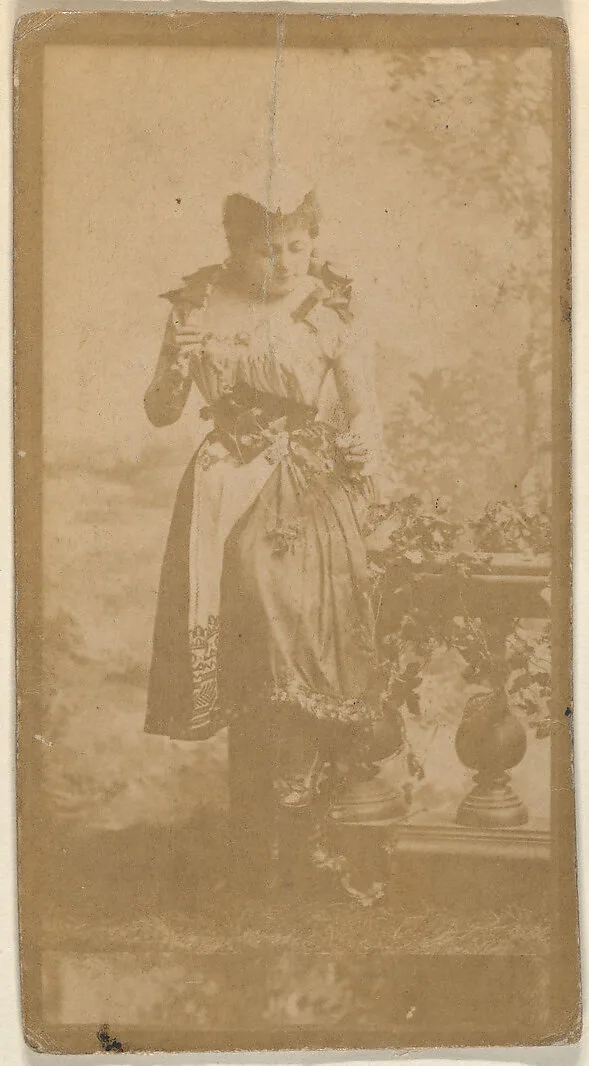 Actress seated on prop balustrade, from the Actresses series (N668) — Unknown