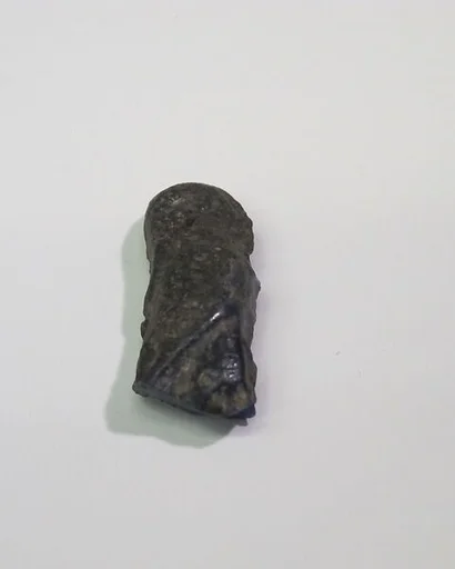 Mold-pressed amulet or fragment