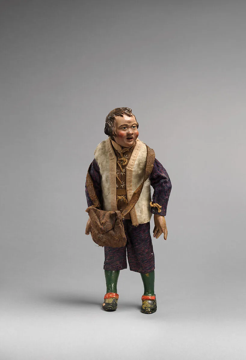 Small man with white furry vest, blue/purple suit, green painted leggings — Unknown