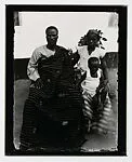 Family portrait with one boy and father in Kente cloth — Alex Agbaglo Acolatse