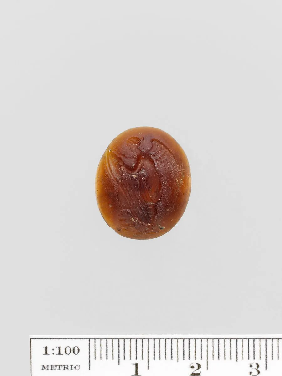 Brown glass oval — Unknown