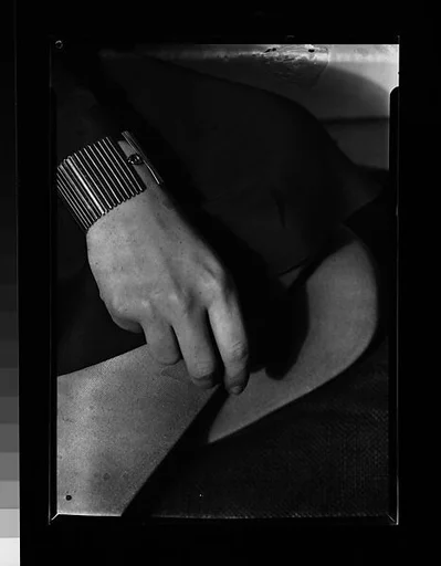 [Hand on Fabric]