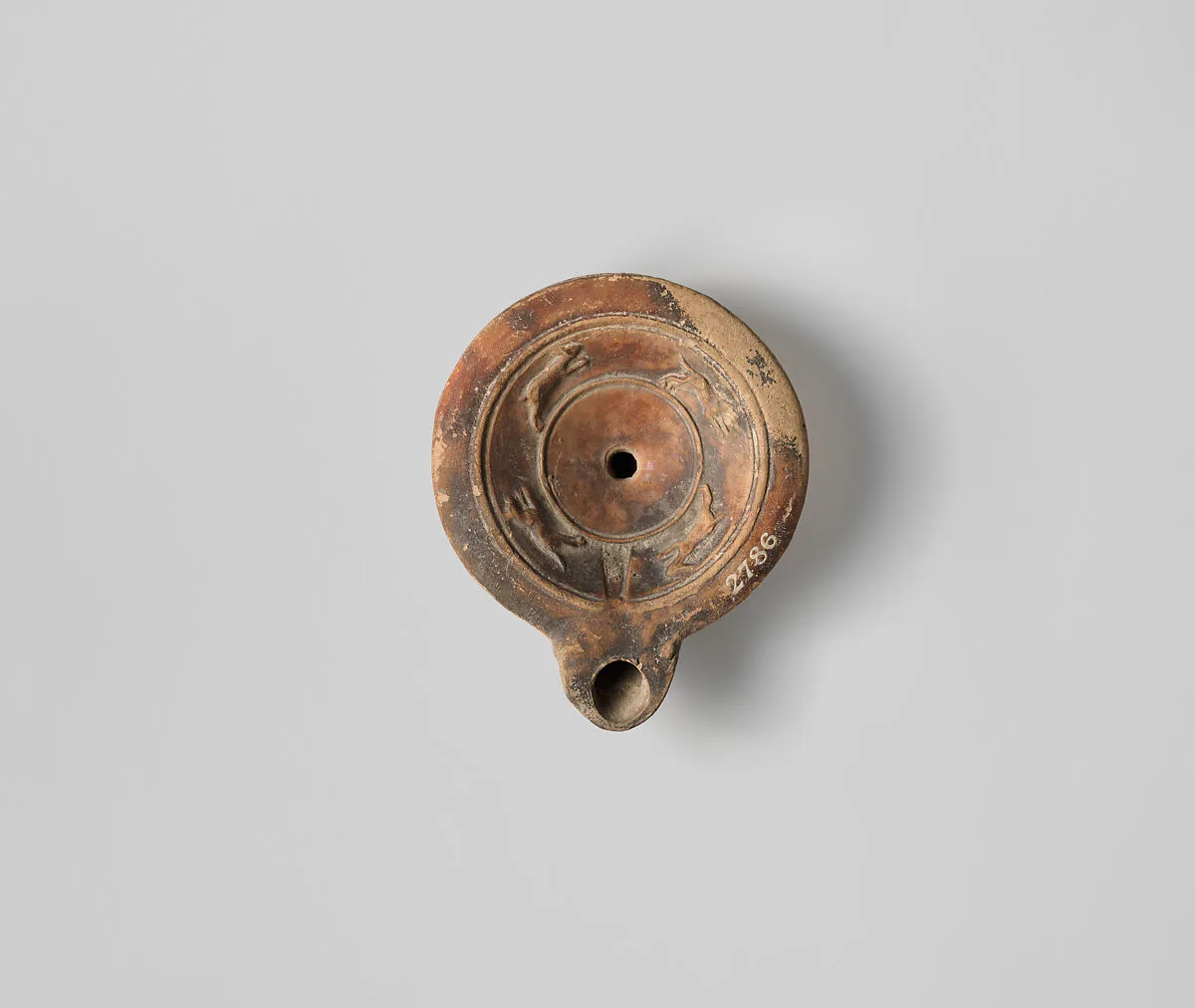 Terracotta oil lamp — Unknown