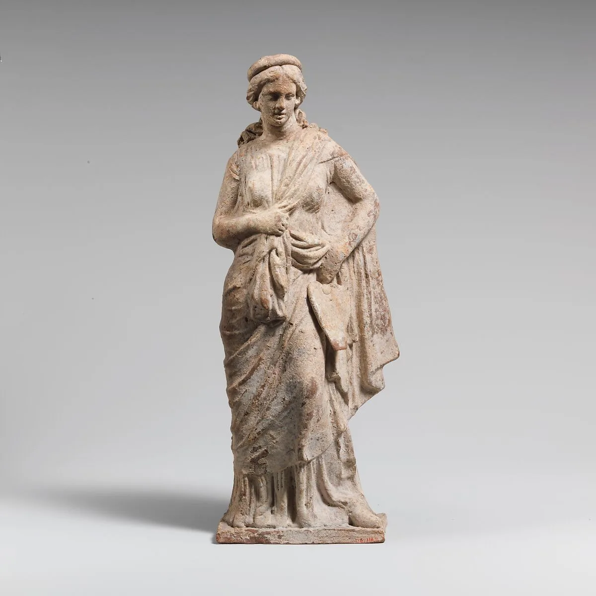 Terracotta statuette of a woman — Unknown