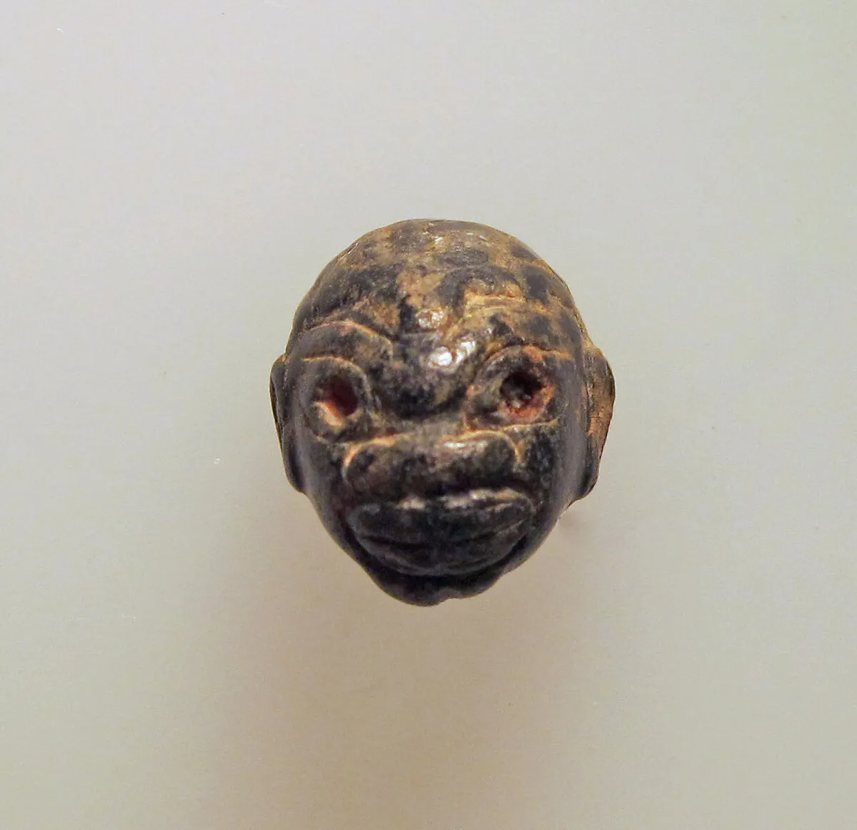Chlorite pendant in the shape of a Black African's head — Unknown