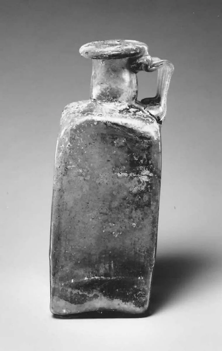 Glass square bottle with base inscription — Unknown