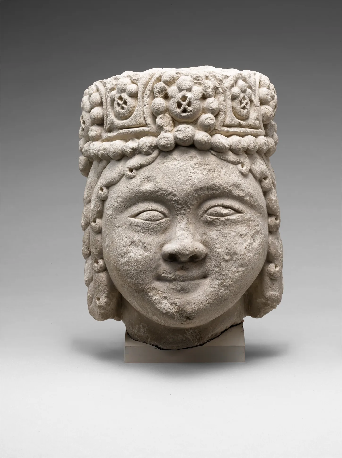 Head from a Figure with a Beaded Headdress — Unknown