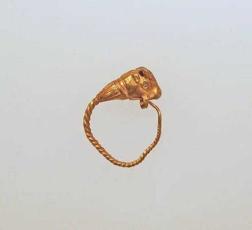 Gold earring with head of a bull