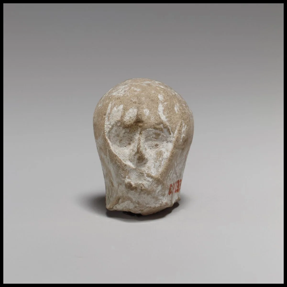 Terracotta head of a veiled woman — Unknown