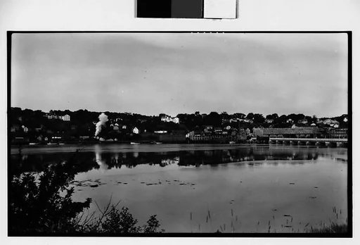 [Houses and Train on Railroad Track, Seen from Across River]