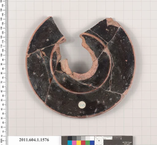 Terracotta fragment of a kylix (drinking cup)