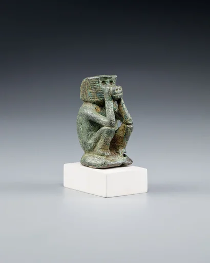 Figure of a squatting cynocephalus ape