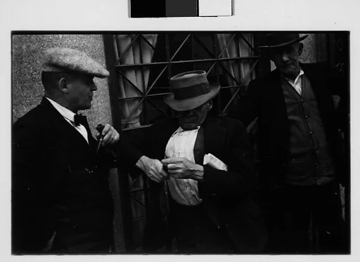 [Two 35mm Film Frames: Three Men on Street, Ossining, New York]