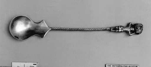 Figure-top spoon
