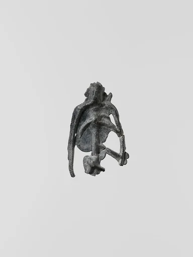 Lead figure, possibly of a skeleton