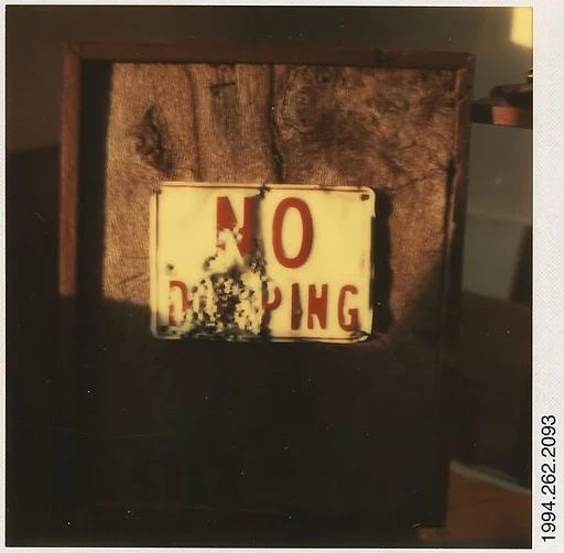 [Framed Sign: "No Dumping"]