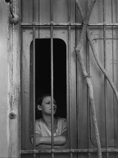 [Woman Behind Barred Window, Havana]