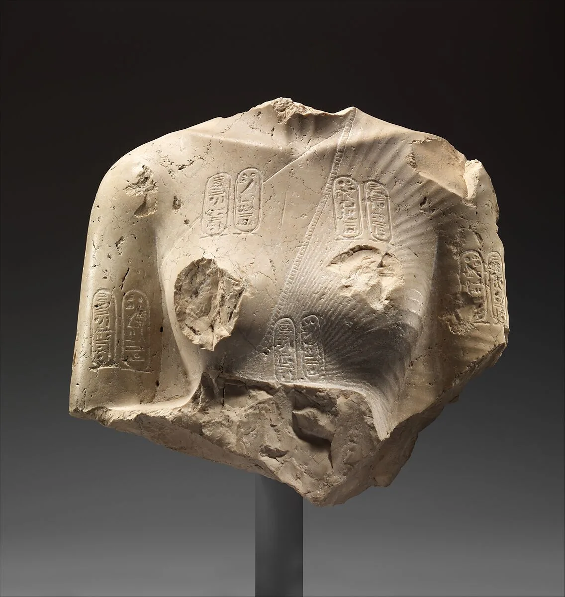 Torso of Nefertiti from a dyad holding a stela in front of the bodies — Unknown