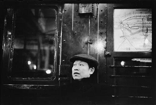 [Four 35mm Film Frames: Subway Passengers, New York City: Man in Cap and Overcoat, Man in Suit and Hat]