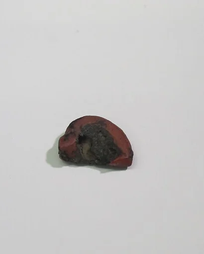 Mold-pressed amulet or fragment