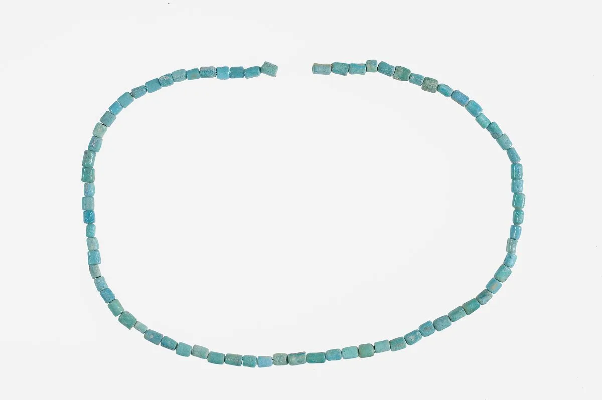 String of Short Cylindrical Beads — Unknown