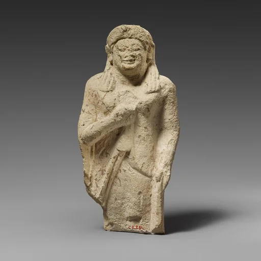 Limestone statuette of a female votary of the kore type