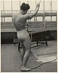 [Male Model Posed Pulling a Rope in Anna Huntington's Rooftop Studio]