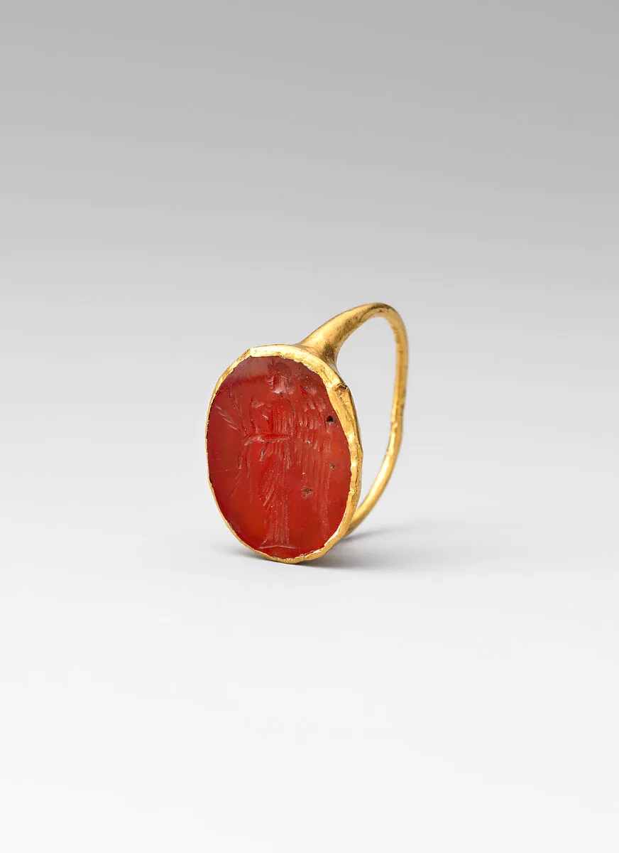 Gold ring with carnelian intaglio: winged Nemesis — Unknown