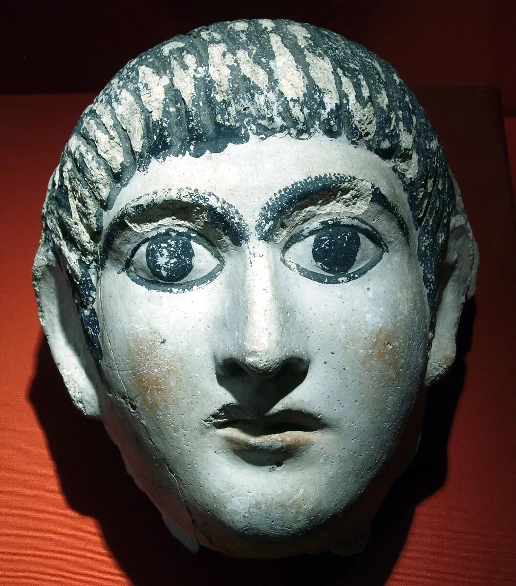 Mask of a man with hair combed forward and a mantle — Unknown
