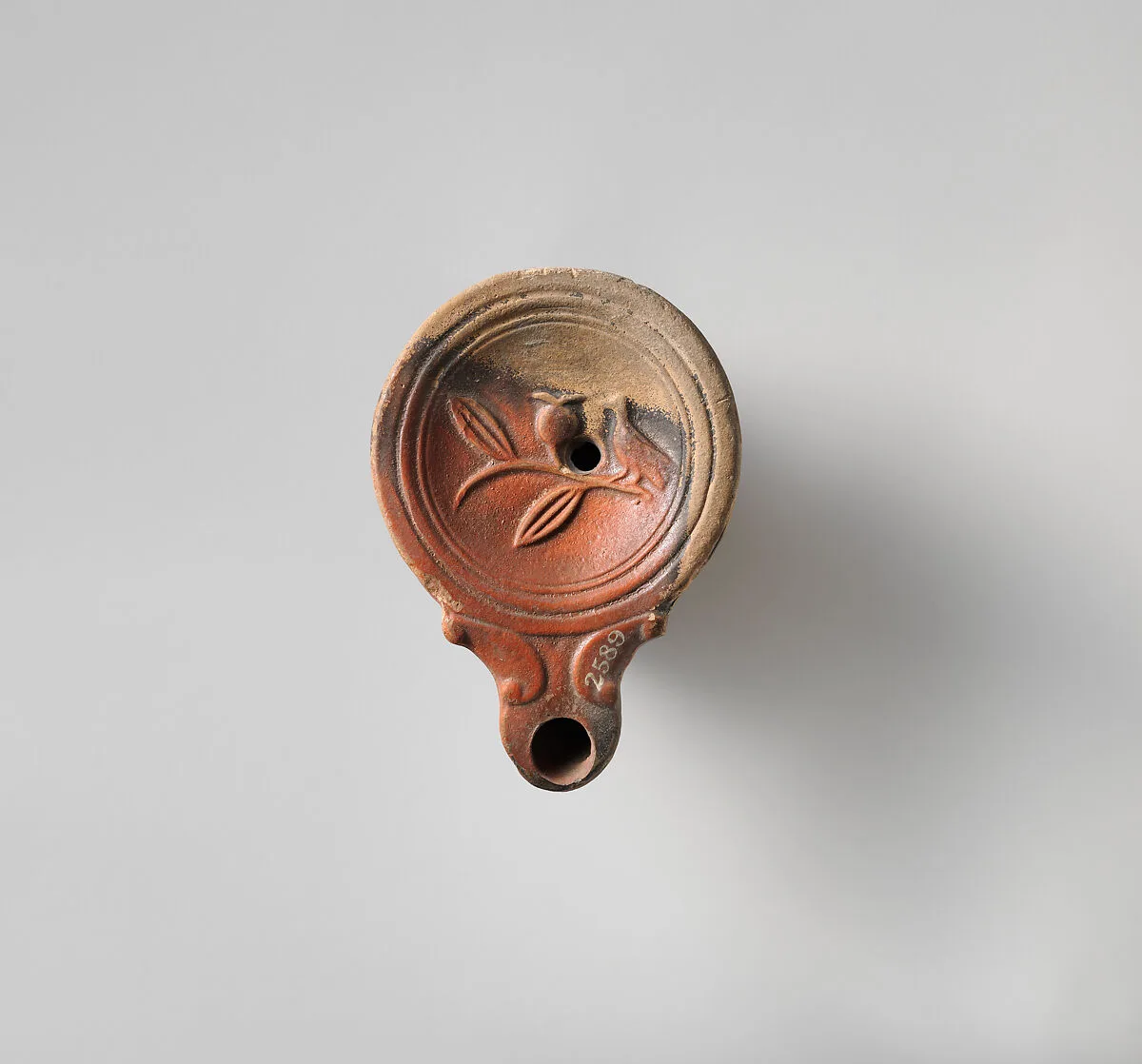 Terracotta oil lamp — Unknown