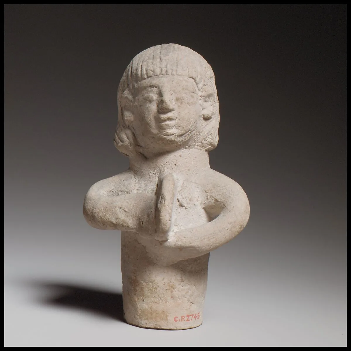 Standing female tambourine player — Unknown