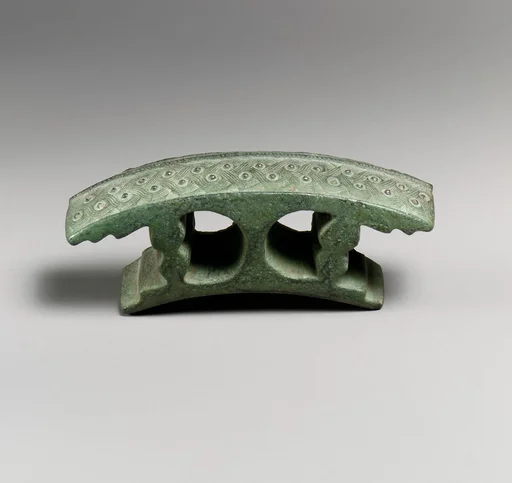 Bronze attachment with silver studs