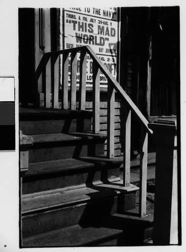 [Two 35mm Film Frames: Shadows on Outside Stairway with Movie Poster, New York City?]