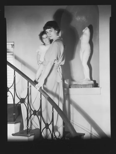 [Jane Fuller Holding Jill Fuller on Stairwell, Bedford, New York]