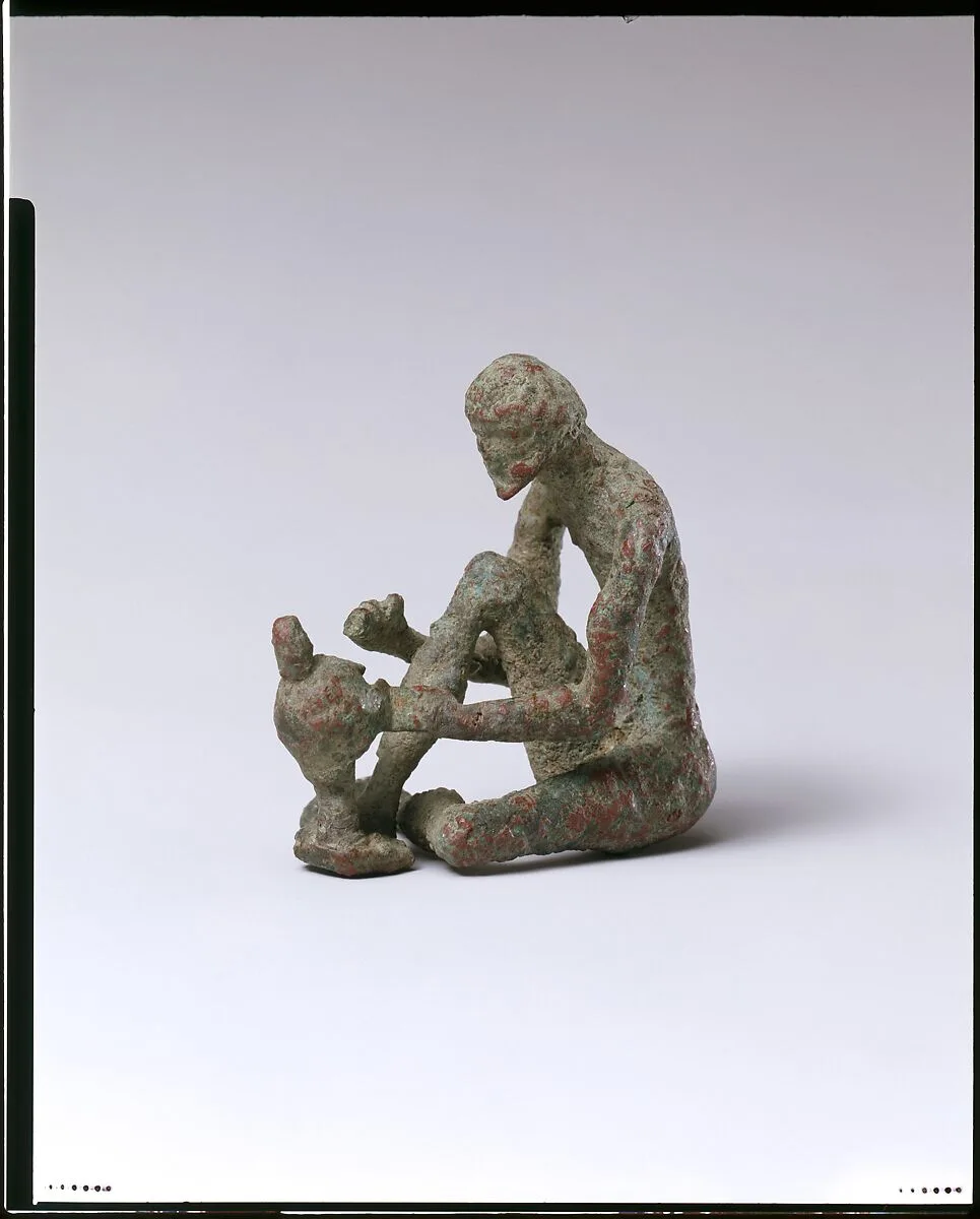 Bronze armorer working on a helmet — Unknown