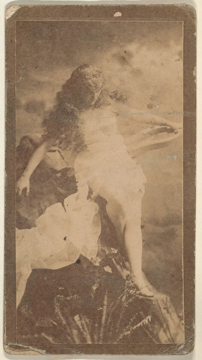 Actress posing on prop boulders, from the Actresses series (N668) — Unknown
