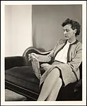[Three Views of Unidentified Woman Seated on Couch]