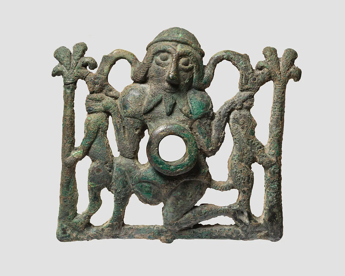 Horse bit cheekpiece in form of a kneeling hero — Unknown
