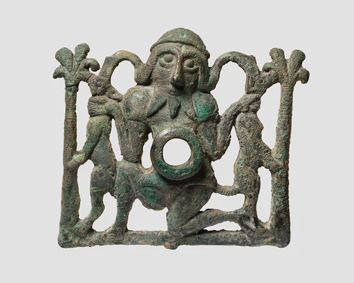 Horse bit cheekpiece in form of a kneeling hero