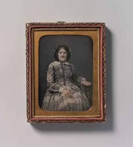 [Seated Elderly Woman Wearing Plaid Dress and Bonnet]