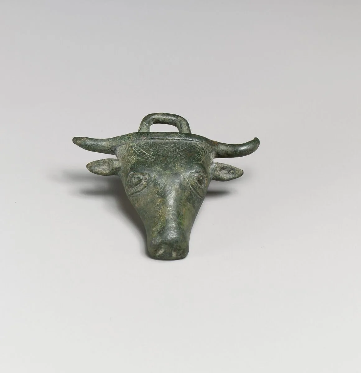 Bronze applique in the form of a bull's head — Unknown