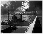 [Burning and Damaged Ships at Pearl Harbor, December 7, 1941, Docked Boat in Foreground]