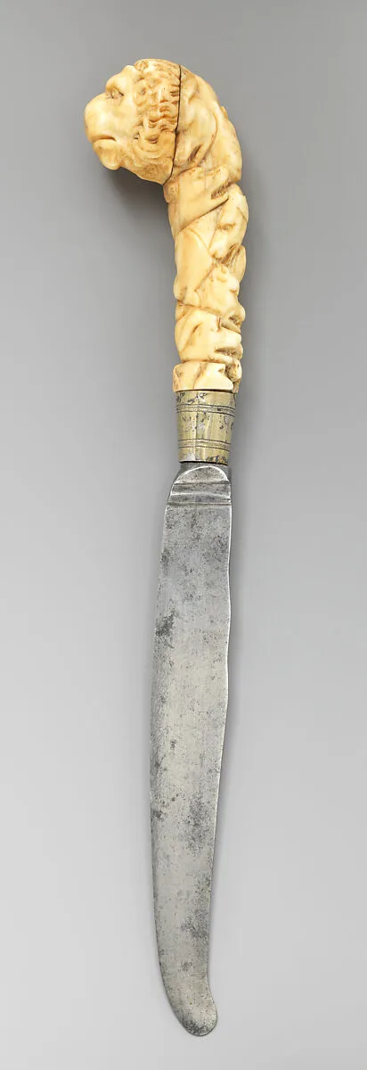 Table knife with handle carved with lion's head — Unknown